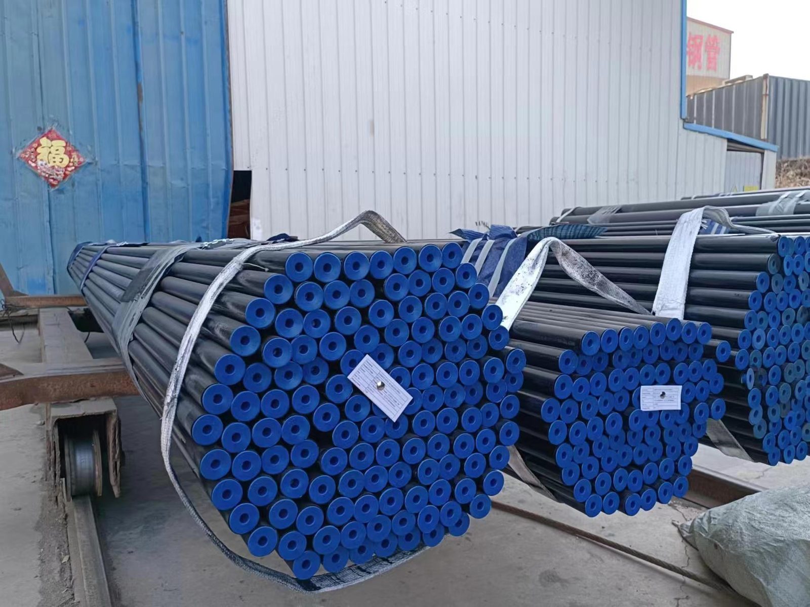 Stacked seamless steel pipes in a storage yard